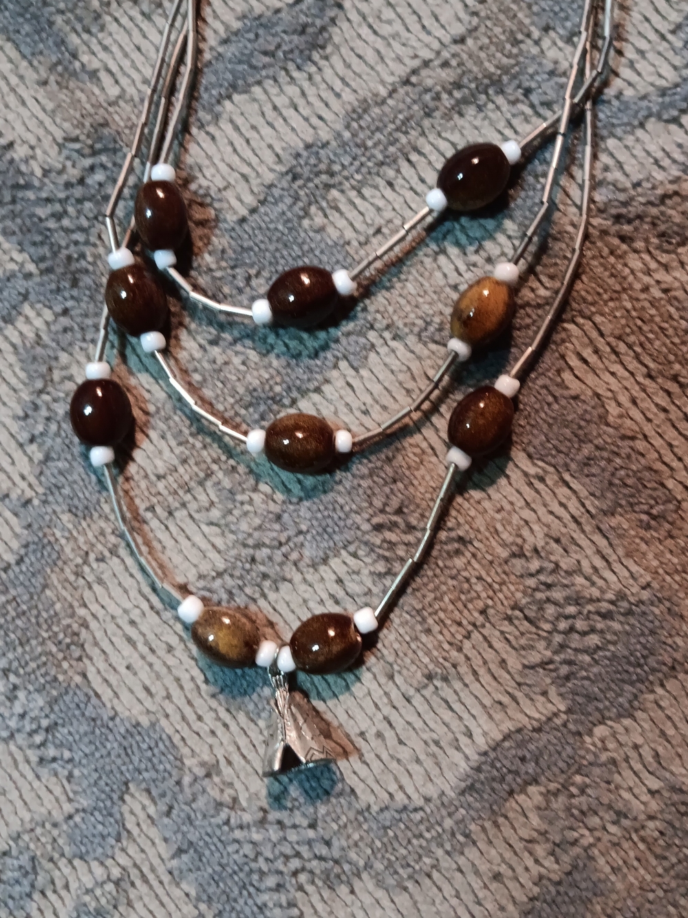 Hand made glass beat it necklace with teepew charm